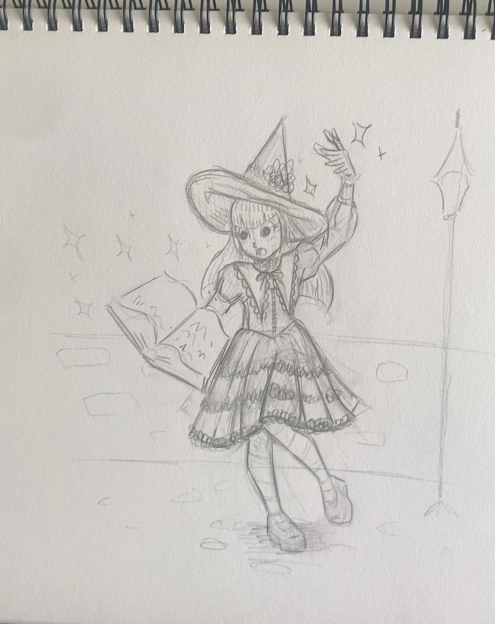 Refined pencil sketch of the witch holding a book and raising one finger